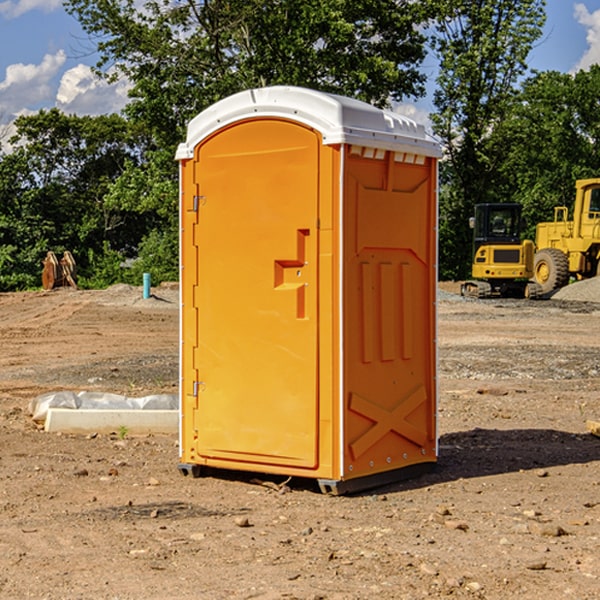 what is the cost difference between standard and deluxe portable toilet rentals in Scroggins Texas